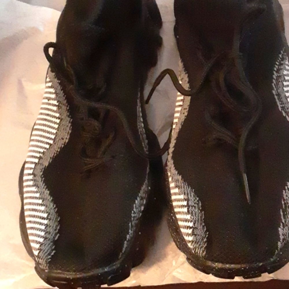 Black sneaker. Ladies size 11.